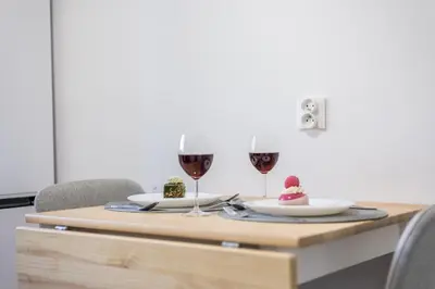 a living room with a table and a couch at 3 Rooms Comfort Capybara Apartment Free Parking by CityBeat in Kraków