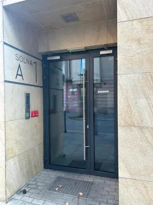 an entrance to a building with a revolving door at Solna Studio Apartment - Comfort Stay in Heart of Kraków in Kraków