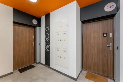 two sets of doors in a hallway at Ciesielskiego Cozy Studio by BookingHost in Kraków