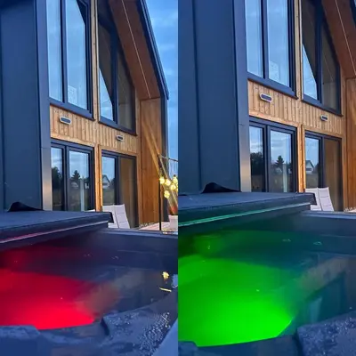 a pool in front of a building with green and red water at Słoneczny Zakątek 2025