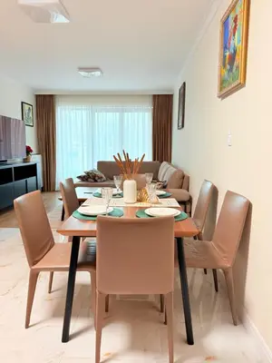 a dining room with a table and chairs at Prywatny apartament przy ulicy Francesco Nullo in Kraków