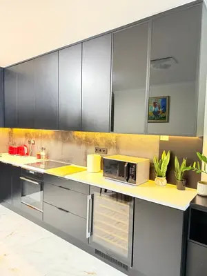 a kitchen with a counter with a microwave on it at Prywatny apartament przy ulicy Francesco Nullo in Kraków