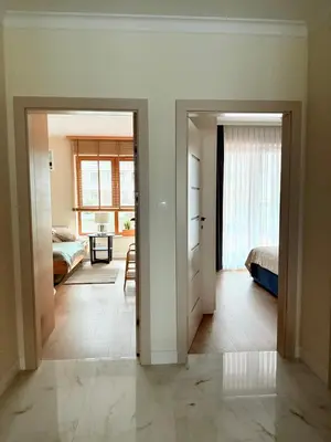 a room with two doors leading to a bedroom at Prywatny apartament przy ulicy Francesco Nullo in Kraków