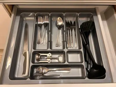 a metal tray with utensils in a sink at Old Town Apartments B15 in Kraków