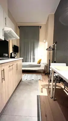 a kitchen with a bed in a room at Small Studio for 1 in Kraków