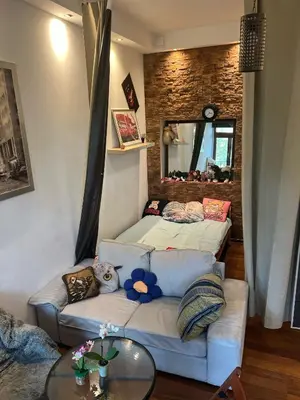 a living room with two beds and a couch at Relax in Kraków