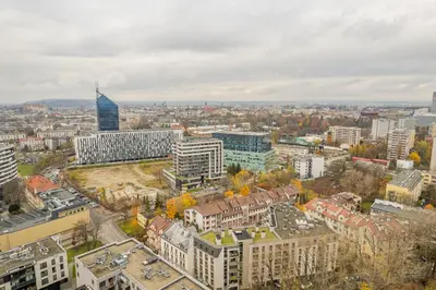 an aerial view of a city with tall buildings at Kraków Grzegórzki Apartment with Balcony - by Rentujemy in Kraków