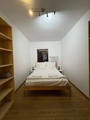 a bedroom with a bed in a white room at Kraków Riverside & Old Town Apartment in Kraków