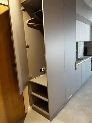 a closet with white cabinets in a kitchen at Rabczański Taras z jacuzzi in Rabka