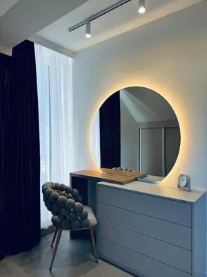 a bathroom with a vanity with a mirror and a chair at Rabczański Taras z jacuzzi in Rabka