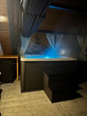 a fish tank with blue lights in a room at Rabczański Taras z jacuzzi in Rabka