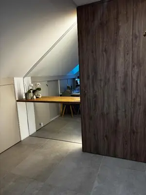 a wooden door in a room with a table at Rabczański Taras z jacuzzi in Rabka