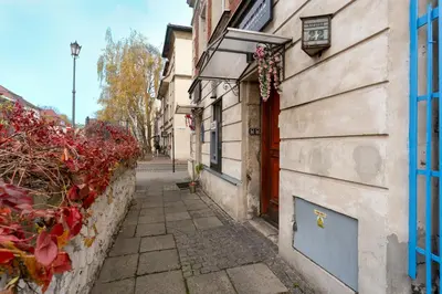 a small alley way with a building and a door at Kazimierz Residence Apartments Parking - by Staymoovers in Kraków