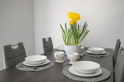 a bedroom with a bed and a window at Cracow Modern Apartment FREE Parking, Views, Tram in Kraków