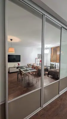 a living room with a table and a couch at KrakowApart Dietla in Kraków
