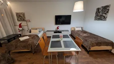 a living room with a table and a couch at KrakowApart Dietla in Kraków