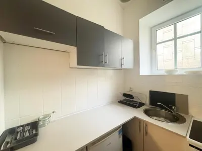 a kitchen with a sink and a counter top at Batory's Tavern in Kraków