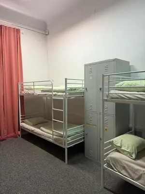 a room with three bunk beds in it at Lanzo 48 in Kraków