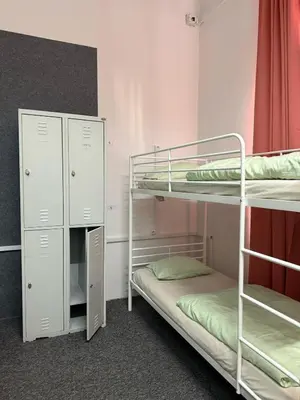 a bathroom with two sinks and two mirrors at Lanzo 48 in Kraków