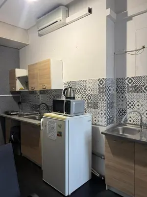 a small bathroom with a toilet and a sink at Lanzo 48 in Kraków