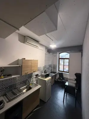 a kitchen with a sink and a counter top at Lanzo 48 in Kraków