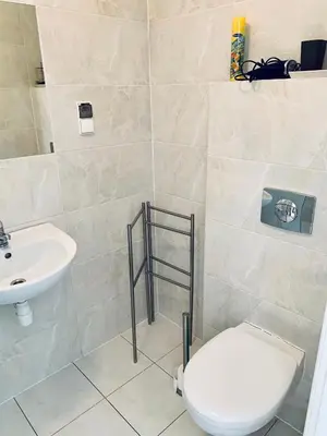 a bathroom with a toilet and a sink at Św Sebastiana 20 in Kraków