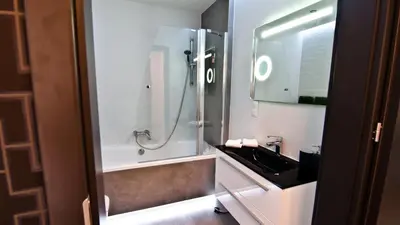 a bathroom with a shower and a sink at Apartament Mateo in Kraków