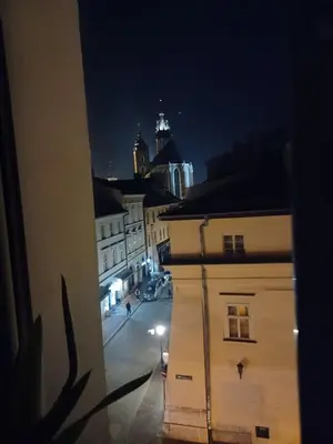 a view of a city street at night at Gold ROOM in Kraków