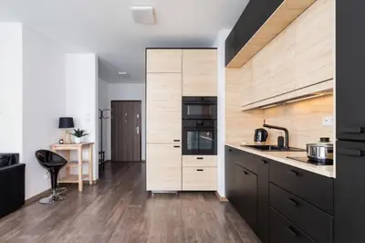 a kitchen with a sink and a counter top at Spacious Studio Zabłocie with Balcony Krakow in Kraków