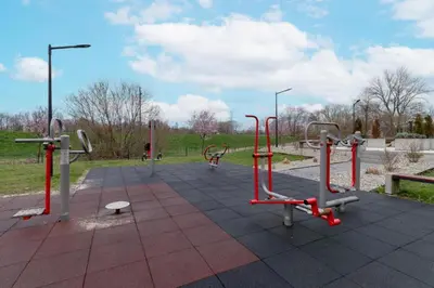 a park with a bunch of exercise equipment at Spacious Studio Zabłocie with Balcony Krakow in Kraków
