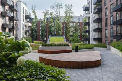 a courtyard in an apartment complex with buildings at Stylish Apartment with Balcony near Krakow Old Town by Noclegi Renters in Kraków