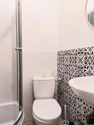 a bathroom with a toilet and a sink at Apartament Różana przy ICE in Kraków