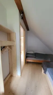 a room with a bunk bed and a window at Piernikowa Chata in Zawoja