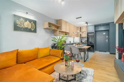 a living room with a couch and a table at Kraków Podgórze Apt - Parking, Balcony - by Rentujemy in Kraków