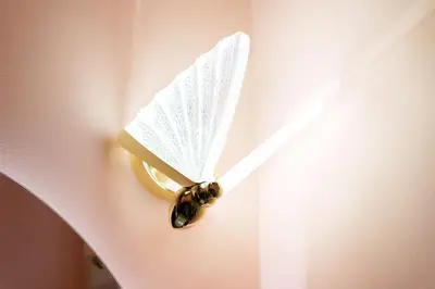 a close up of a clock with a bee on it at Candy Colored House - Old Town in Kraków