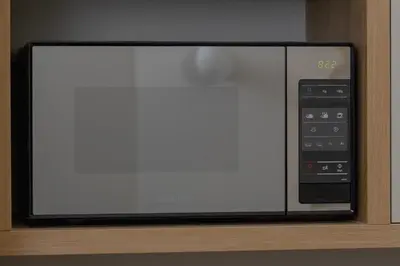 a microwave oven sitting on top of a shelf at Studio apartment - Augustiańska 1 street in Kraków