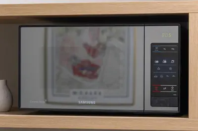 a microwave oven sitting on top of a shelf at Kazimierz - Augustiańska 1 street in Kraków