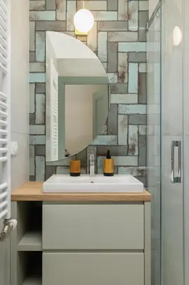 a bathroom with a sink and a mirror at Studio - Augustiańska 1 - Kazimierz in Kraków