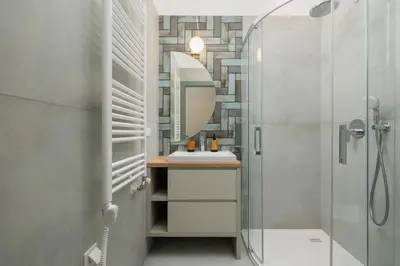 a bathroom with a sink and a shower at Studio - Augustiańska 1 - Kazimierz in Kraków