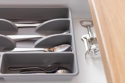 a drawer with silver utensils in it at Studio - Augustiańska 1 - Kazimierz in Kraków