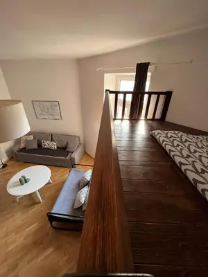 a living room with a couch and a table at Apt for six in Kraków