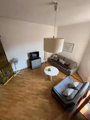 a living room with a couch and a table at Apt for six in Kraków