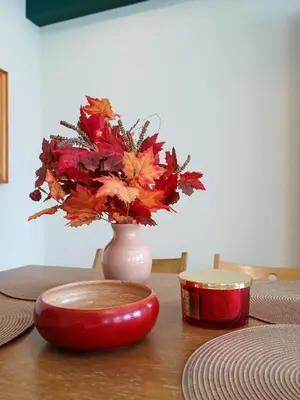 a vase with flowers in it sitting on a table at Zwierzogród in Rabka