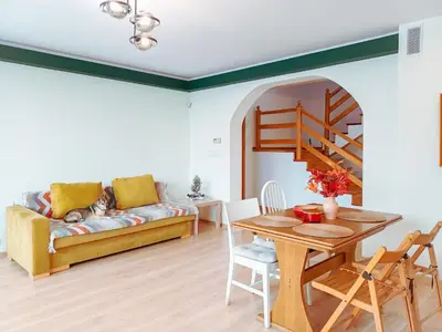 a living room with a couch and a table at Zwierzogród in Rabka