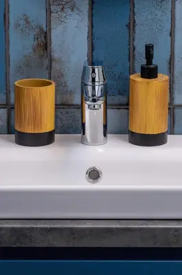 a sink with two cups on top of it at 1-bedroom apartment - Augustiańska 1 street in Kraków