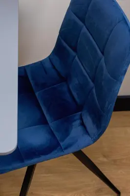 a blue ball chair sitting next to a table at 1-bedroom apartment - Augustiańska 1 street in Kraków