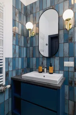 a bathroom with a sink and a mirror at 1 bedroom apartment - Augustiańska 1 in Kraków
