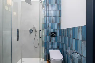 a bathroom with a shower with a toilet and a glass shower at 1 bedroom apartment - Augustiańska 1 in Kraków