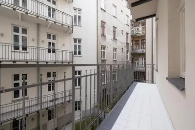 an empty corridor in an apartment building at Cozy studio - Augustiańska 1 street in Kraków