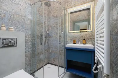 a bathroom with a blue sink and a shower at Studio for 2 - Augustiańska 1 - Kazimierz in Kraków